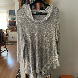 Women’s top with flared bottom and “ruffle” neck